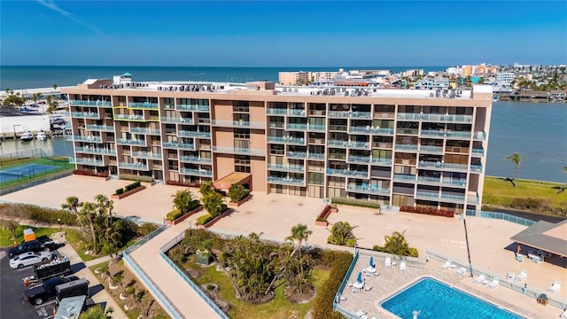 view of building exterior with a water view