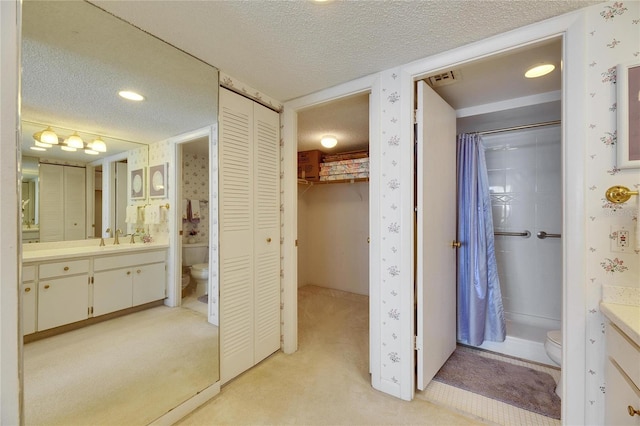 full bathroom with a closet, a textured ceiling, and toilet