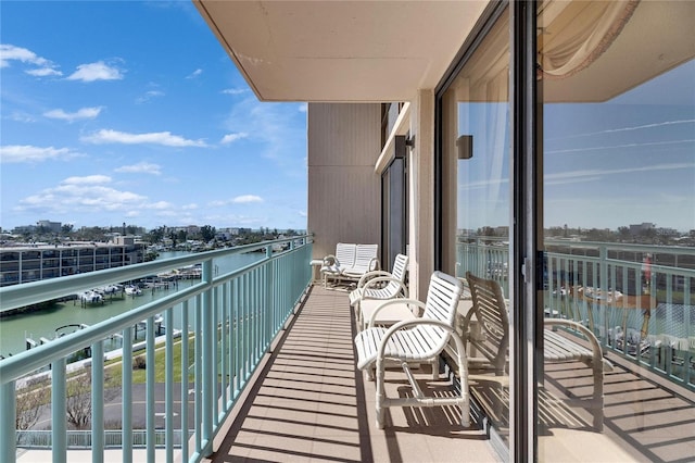 balcony featuring a water view