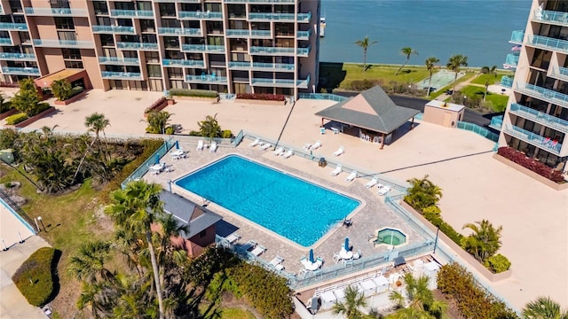 view of swimming pool featuring a water view