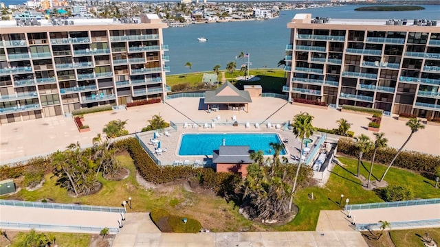 birds eye view of property with a water view