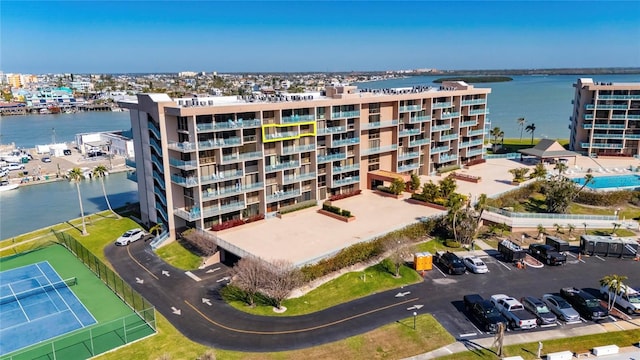 birds eye view of property with a water view