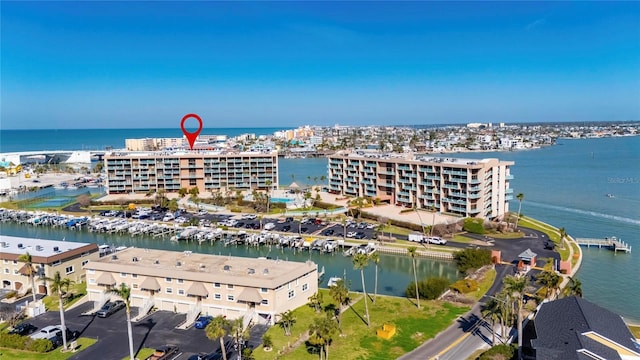 birds eye view of property with a water view