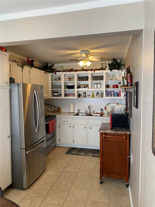 kitchen with ornamental molding, stainless steel appliances, white cabinetry, open shelves, and a sink