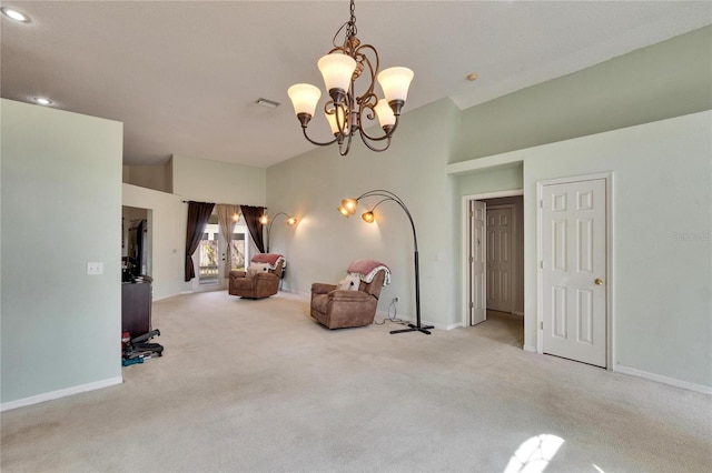 sitting room with carpet floors, an inviting chandelier, baseboards, and visible vents