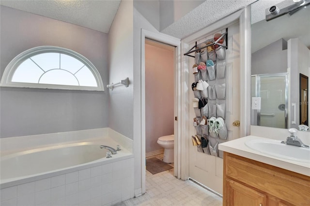 full bath featuring a stall shower, toilet, a textured ceiling, vanity, and a bath