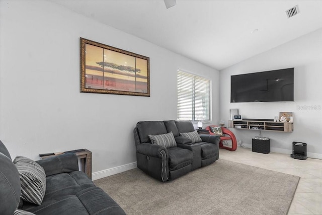 tiled living area with visible vents, lofted ceiling, and baseboards