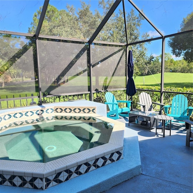 view of swimming pool featuring a lanai, an outdoor hot tub, and a patio area