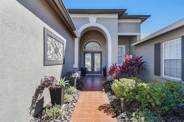 doorway to property with french doors and stucco siding