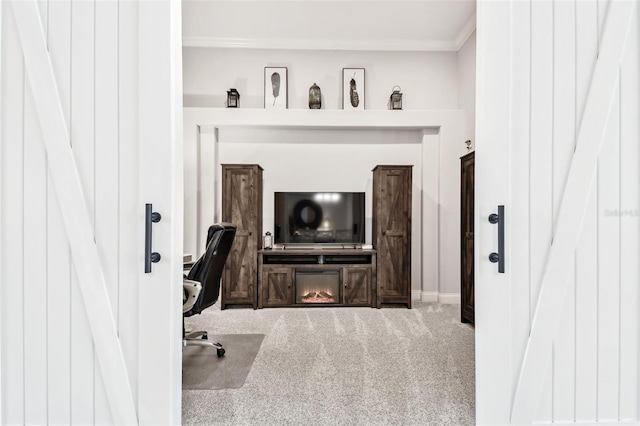 carpeted home office featuring crown molding