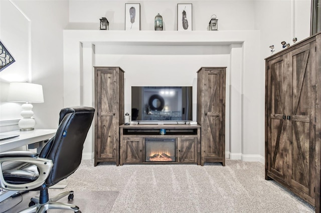 carpeted office space featuring baseboards