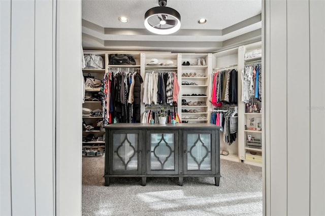 walk in closet featuring carpet