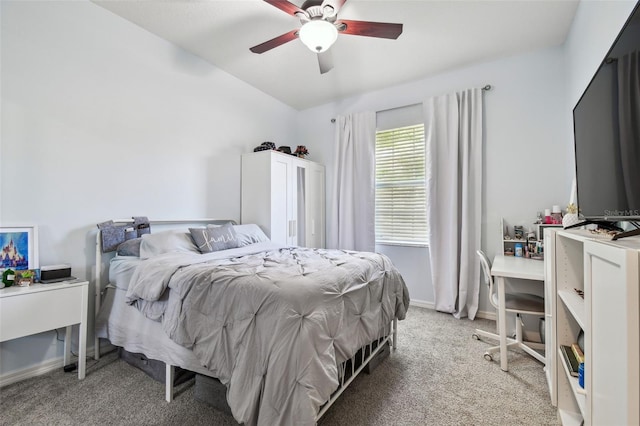 bedroom featuring ceiling fan, baseboards, and light colored carpet