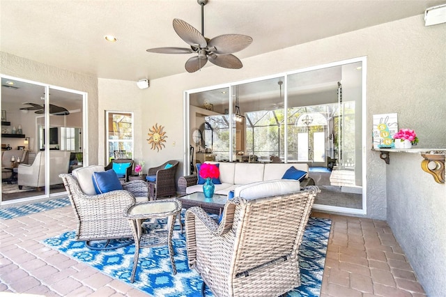 view of patio / terrace featuring ceiling fan and an outdoor living space