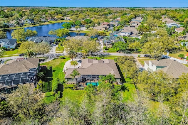 birds eye view of property with a water view and a residential view