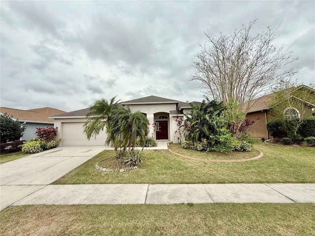 view of front of property with a garage, a front yard, driveway, and stucco siding