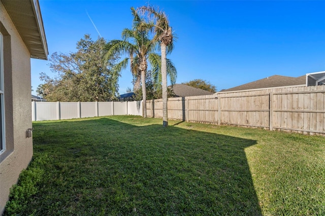 view of yard featuring a fenced backyard