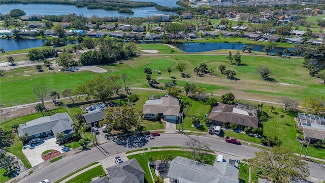 bird's eye view with a residential view, a water view, and golf course view