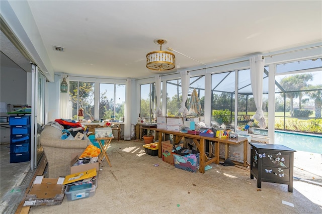 sunroom with visible vents and plenty of natural light