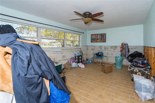 interior space with ceiling fan