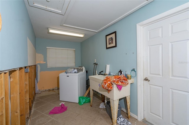 clothes washing area with tile patterned flooring, laundry area, and washer / clothes dryer