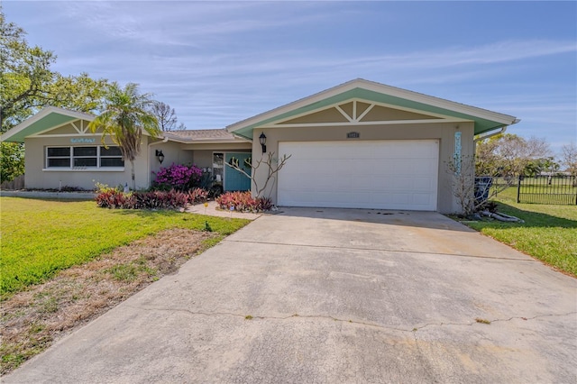 single story home featuring stucco siding, driveway, a front lawn, fence, and a garage