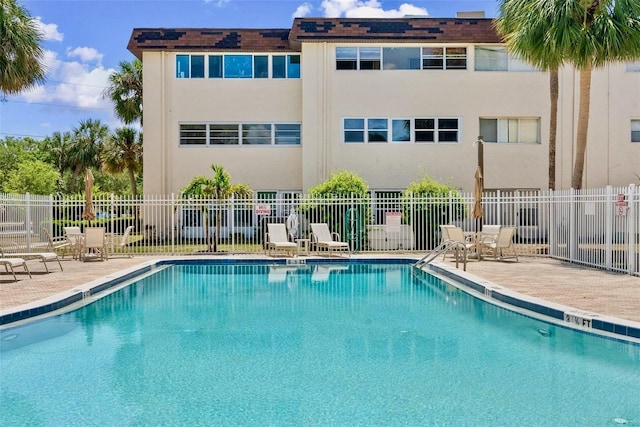 209 NE Lincoln Cir N Unit 105, Saint Petersburg, FL 33702 - community pool featuring fence and a patio area