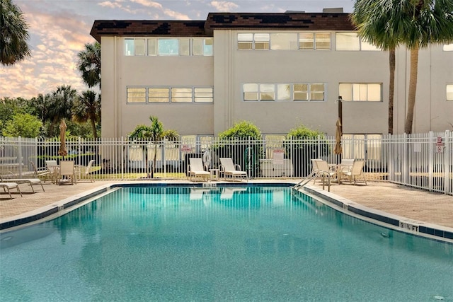 209 NE Lincoln Cir N Unit 105, Saint Petersburg, FL 33702 - community pool featuring fence and a patio