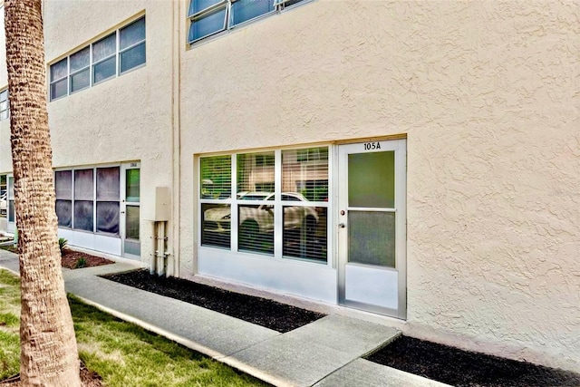 209 NE Lincoln Cir N Unit 105, Saint Petersburg, FL 33702 - entrance to property with stucco siding