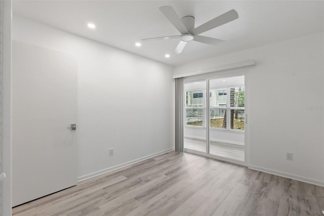 209 NE Lincoln Cir N Unit 105, Saint Petersburg, FL 33702 - empty room with light wood-style flooring, a ceiling fan, recessed lighting, and baseboards