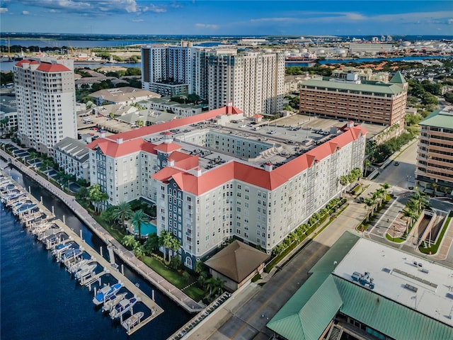 birds eye view of property featuring a city view and a water view
