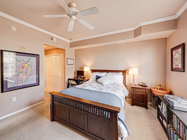 bedroom with a closet, light carpet, baseboards, visible vents, and ornamental molding