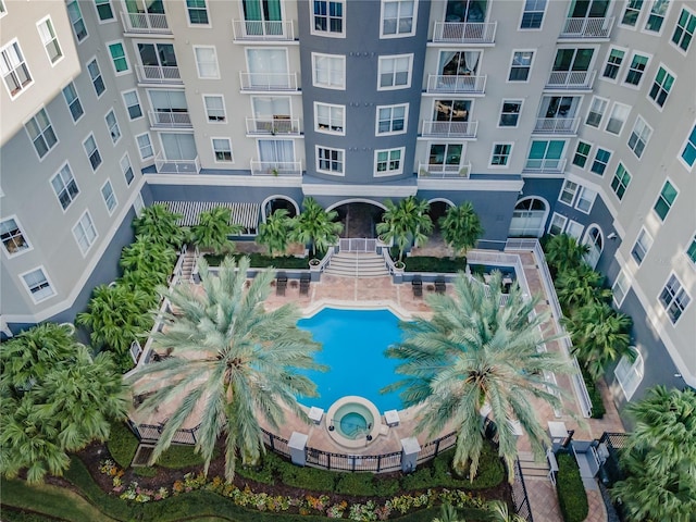 view of swimming pool with stairway