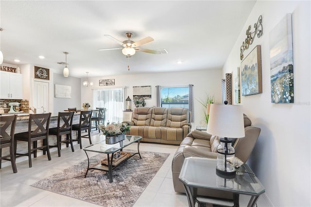 living area featuring recessed lighting, ceiling fan, and light tile patterned floors