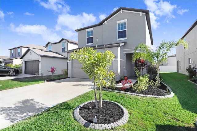 traditional-style home with a front yard, a residential view, concrete driveway, and stucco siding