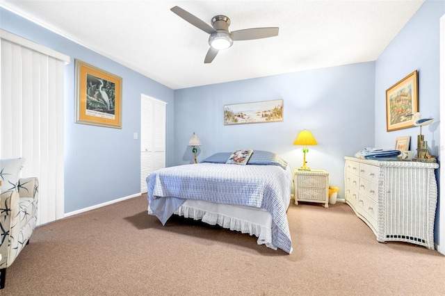 carpeted bedroom with a ceiling fan and baseboards