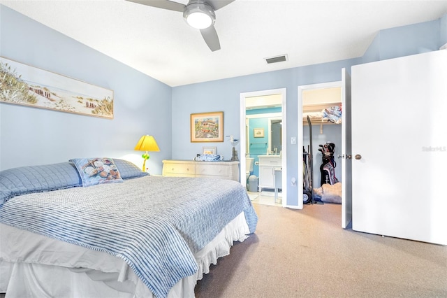 bedroom with ceiling fan, carpet floors, visible vents, a spacious closet, and a closet