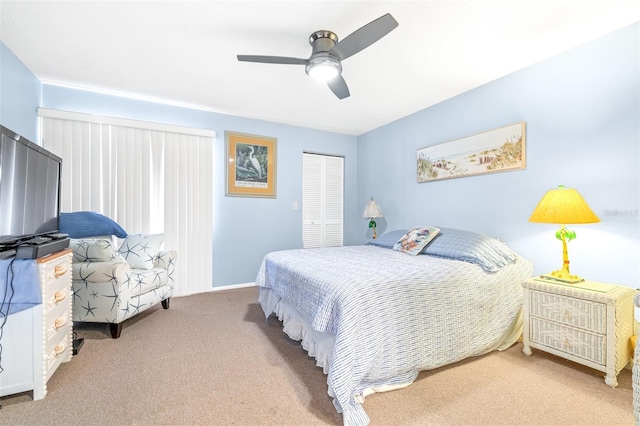 bedroom with carpet floors, a ceiling fan, and a closet