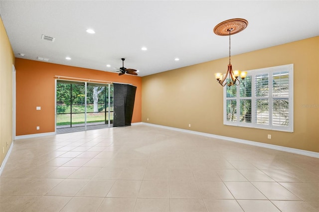 empty room with recessed lighting, a healthy amount of sunlight, visible vents, and baseboards