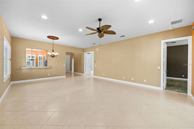 interior space with recessed lighting, ceiling fan with notable chandelier, visible vents, and baseboards