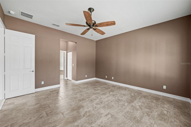 spare room featuring visible vents, baseboards, and ceiling fan