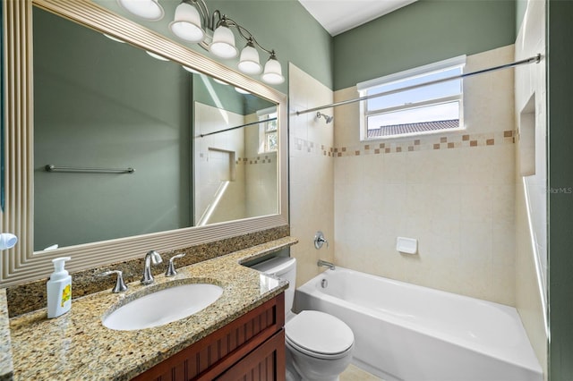 bathroom featuring bathtub / shower combination, toilet, and vanity