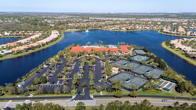 birds eye view of property with a water view