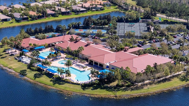 birds eye view of property with a water view