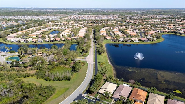 aerial view with a residential view and a water view