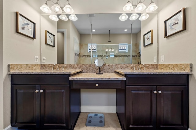 bathroom with vanity, a walk in shower, and visible vents