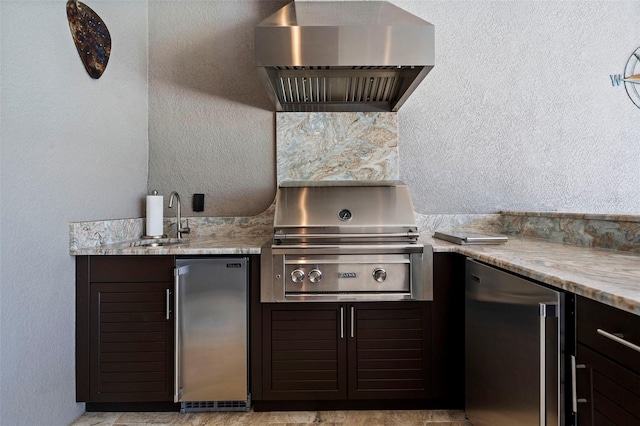 view of patio with a sink and a grill