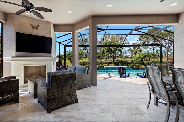 view of patio with an outdoor pool, a lanai, a ceiling fan, and an outdoor living space with a fireplace