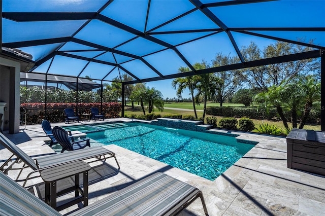 view of swimming pool with a pool with connected hot tub, a lanai, and a patio area