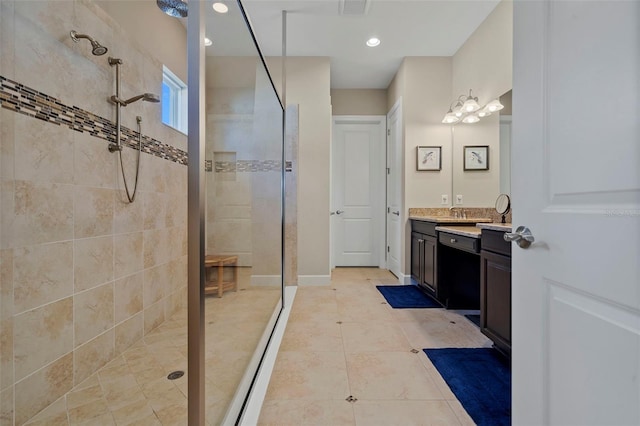 full bathroom with vanity, baseboards, recessed lighting, tile patterned flooring, and walk in shower